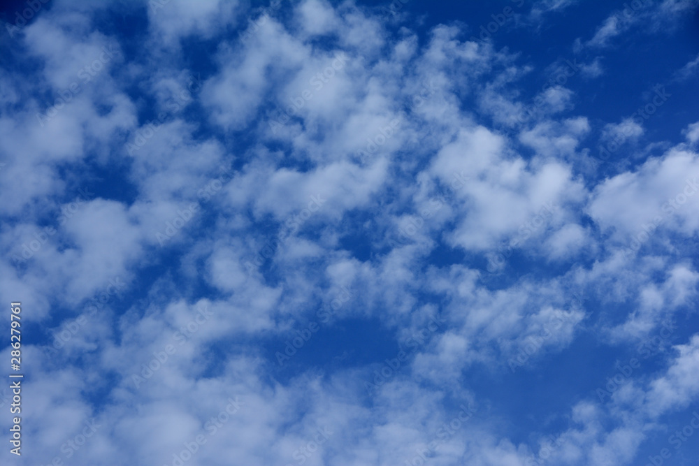 Blue sky with small clouds. Background image Blue sky with small clouds. Background image
