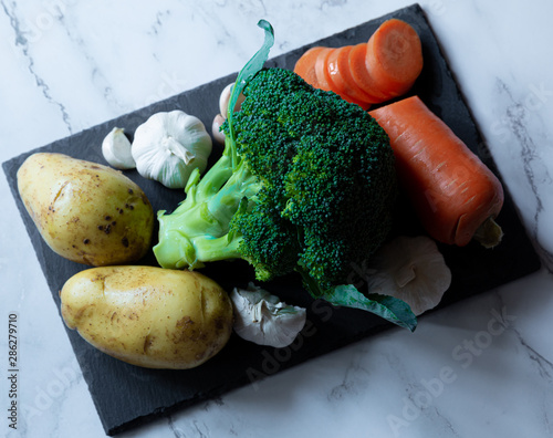 Fototapeta Naklejka Na Ścianę i Meble -  fresh broccoli and potato with carrots and garlic