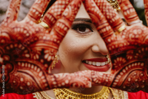Portrait of smiling Indian bride on wedding day