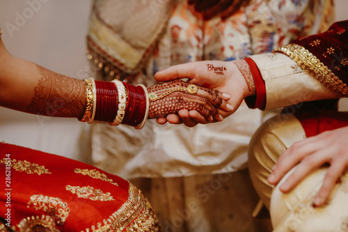 Happy lovers Hindus hold each other hands