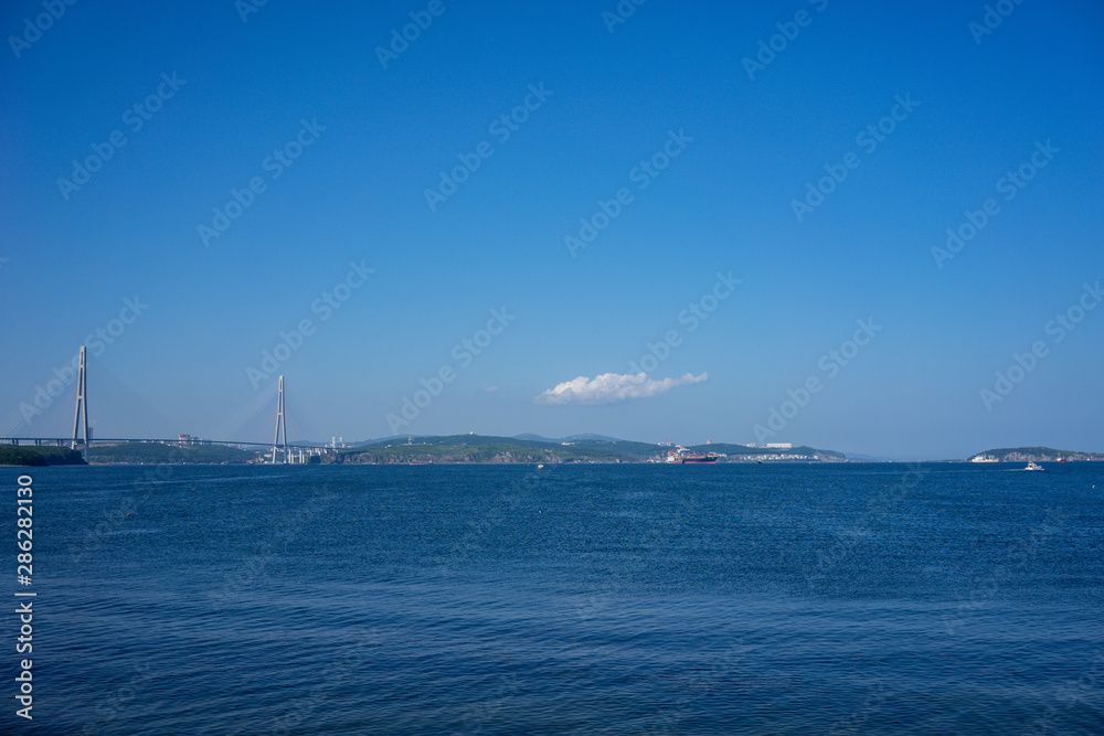 Marine landscape with views of the Russian bridge on the horizon. Marine landscape with views of the Russian bridge on the horizon.