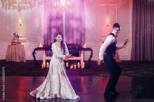 The first dance of Indian newlyweds at their wedding