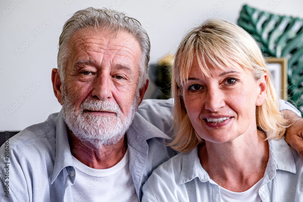 Senior couple portrait. White man and woman holding each other, happy confident smile. Senior couple portrait. White man and woman holding each other, happy confident smile.