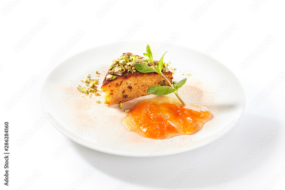 Healthy Nut Cake with Apricot Jam Isolated on White Background Healthy Nut Cake with Apricot Jam Isolated on White Background