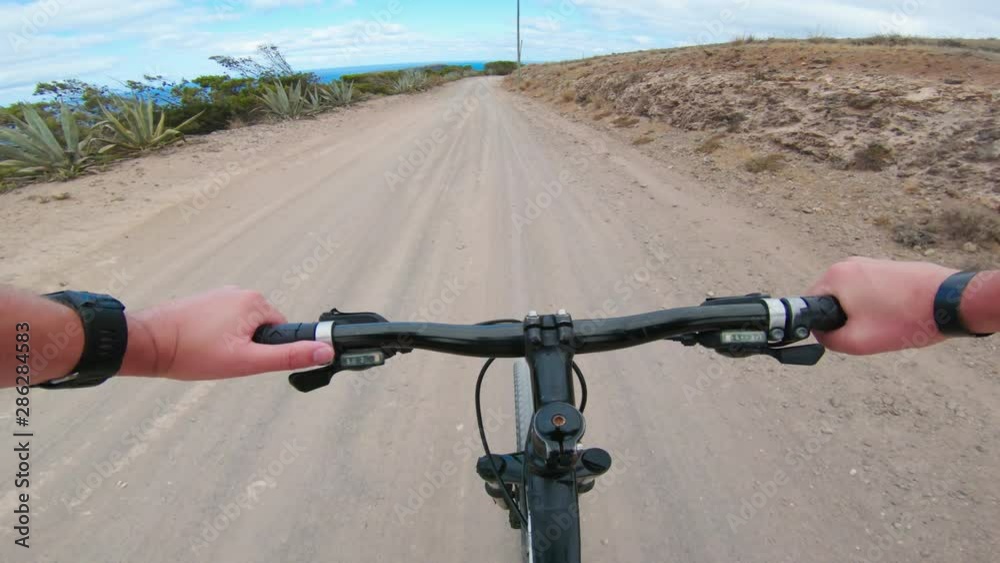 Point of view from tourist riding bicycle on bumpy road Point of view from tourist riding bicycle on bumpy road
