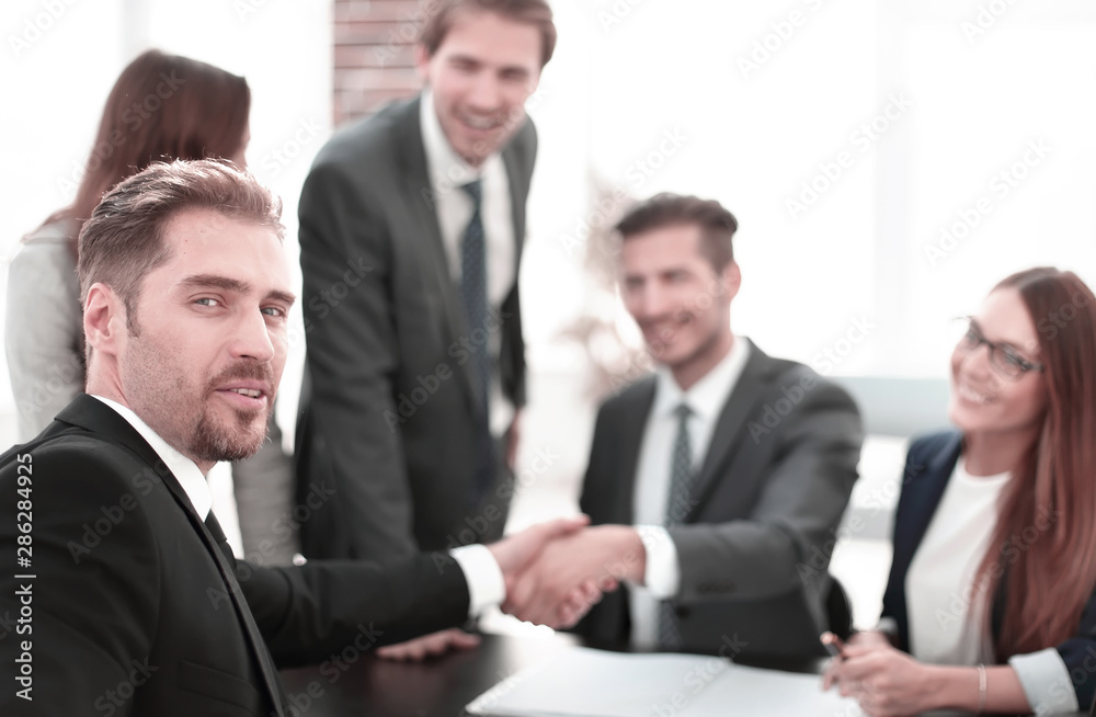 Business people doing handshake after agreement Business people doing handshake after agreement