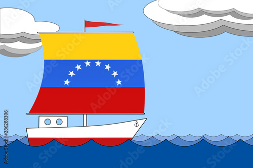 Ship with a sail the color of the flag of Venezuela floats on the sea during the day under a blue sky with clouds. photo