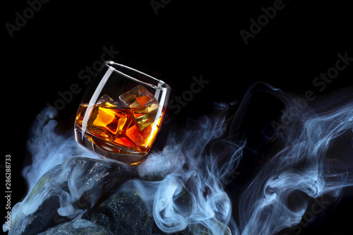 Fotografie Glass of whiskey with ice