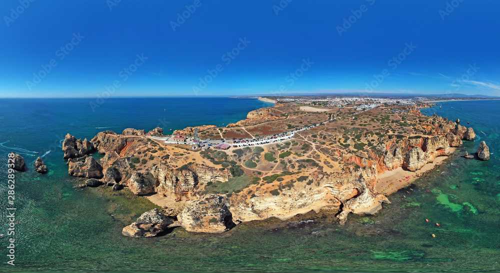 Panoramic aerial from natural rocks and the lighthouse at Ponte Piedade in Lagos Portugal