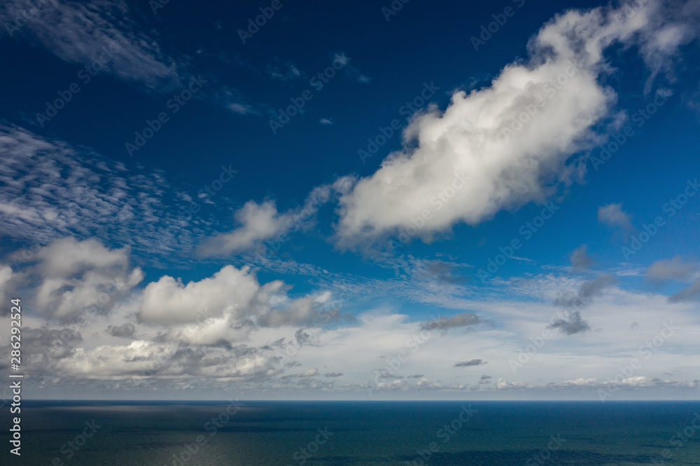 Peaceful sea and cloudy blue sky. Horizon line. Peaceful sea and cloudy blue sky. Horizon line.