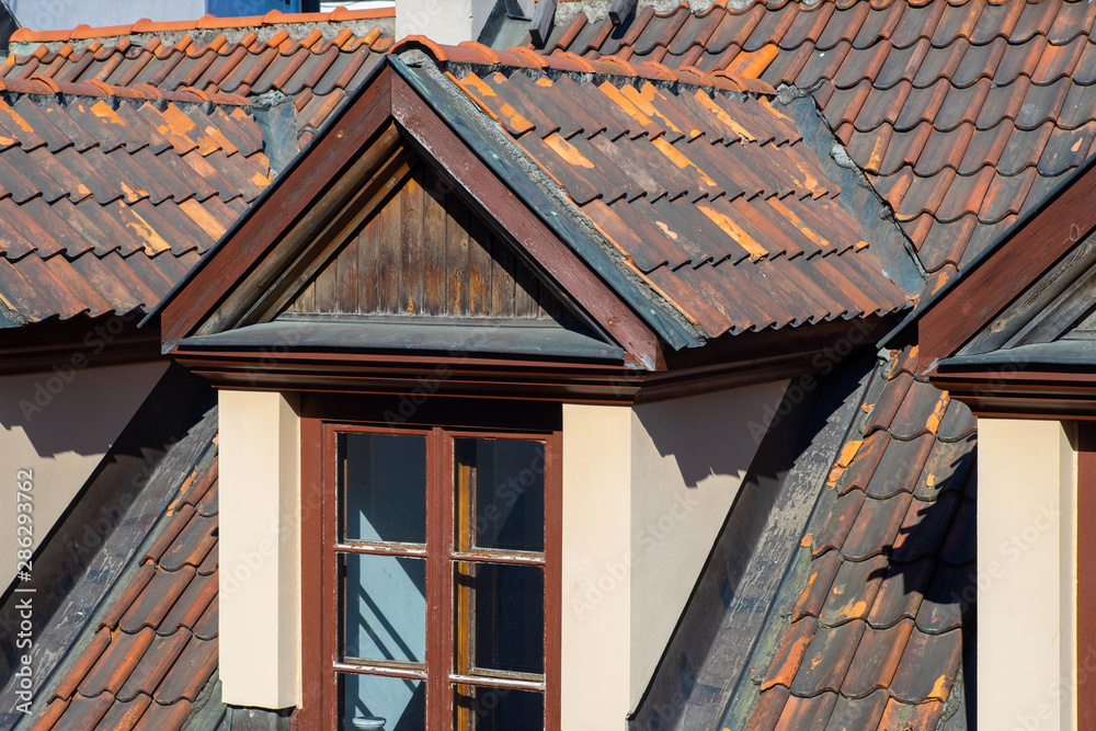 Rust tile roofs in Old Riga. Sunny day. Rust tile roofs in Old Riga. Sunny day.