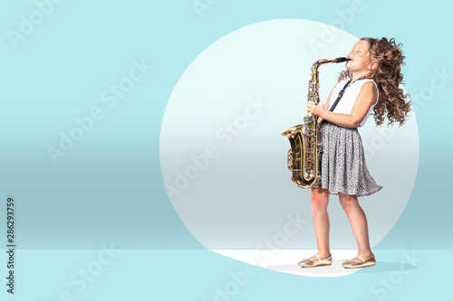 Photography a female gradeschooler saxophonist