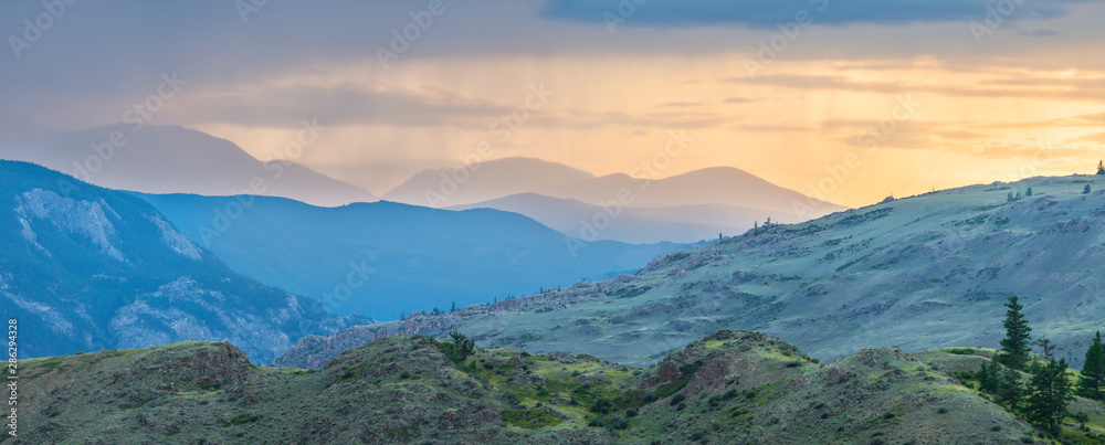 Panoramic view of a mountain landscape, sunset light