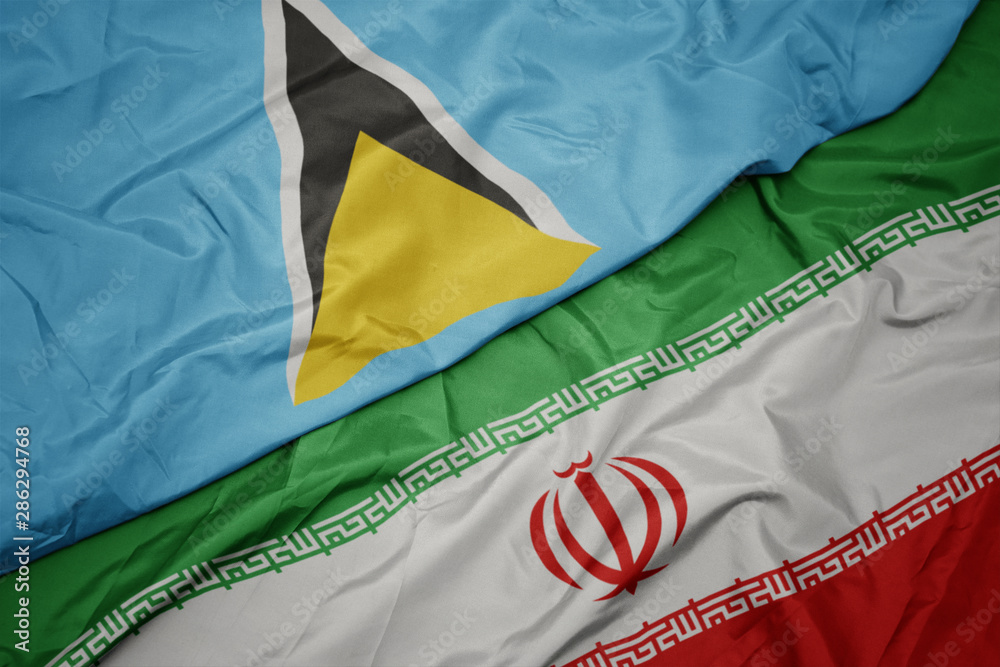 waving colorful flag of iran and national flag of saint lucia.