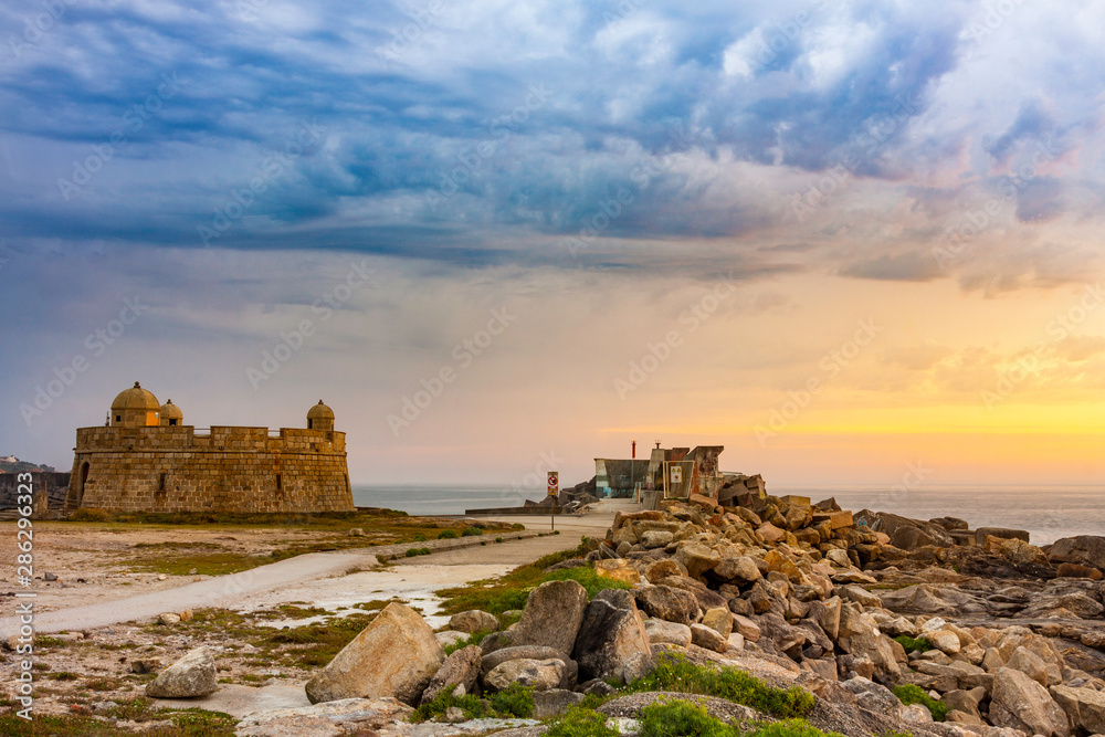LANDSCAPE OF THE COAST WITH CASTLE AN ROCKS AND SKY HORIZON WITH CLOUDS