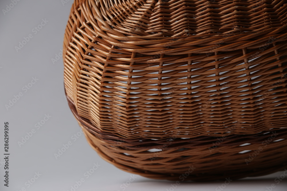 Fototapeta premium Wicker or wattle basket on a white background
