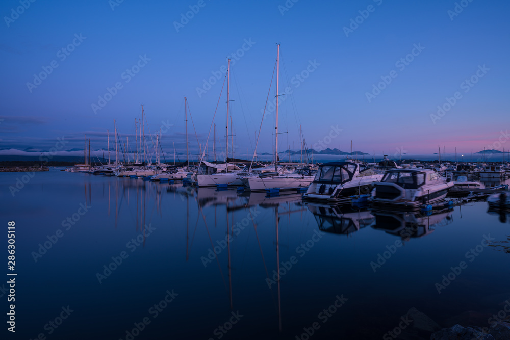 Beautiful sunset colours over harbour of Molde Beautiful sunset colours over harbour of Molde