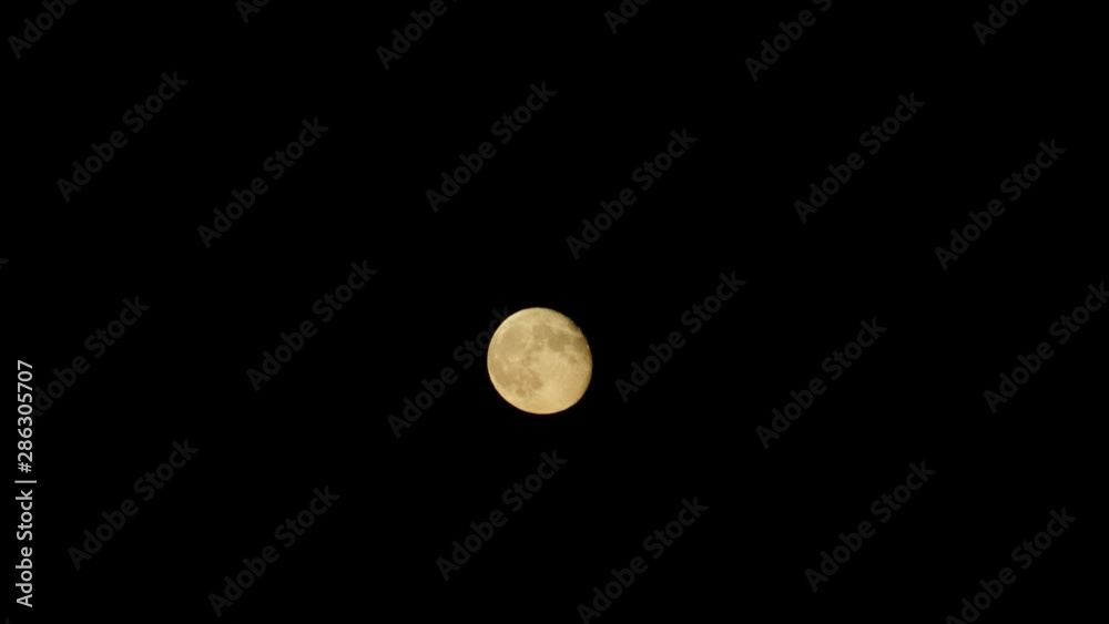 Full moon night sky. moon time lapse. moon light. clouds and moon ,beautiful nightly spooky seamless loop background Full moon night sky. moon time lapse. moon light. clouds and moon ,beautiful nightly spooky seamless loop background