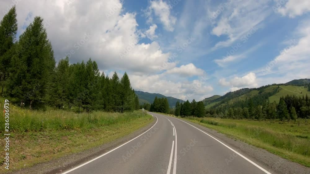 Beautiful nature POV vehicle drive, hilly scenery car travel, mediterranean coast curvy asphalt road point of view, blue sky with clouds horizon. POV driving. video footage stock. 4K Beautiful nature POV vehicle drive, hilly scenery car travel, mediterranean coast curvy asphalt road point of view, blue sky with clouds horizon. POV driving. video footage stock. 4K