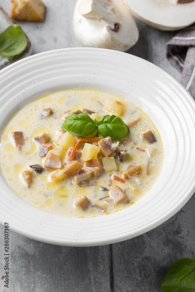 Cheese soup with mushrooms, potatoes, carrots and croutons Delicious cozy first course, autumn food Cheese soup with mushrooms, potatoes, carrots and croutons Delicious cozy first course, autumn food
