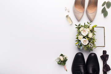 Wedding shoes and accessories on white background