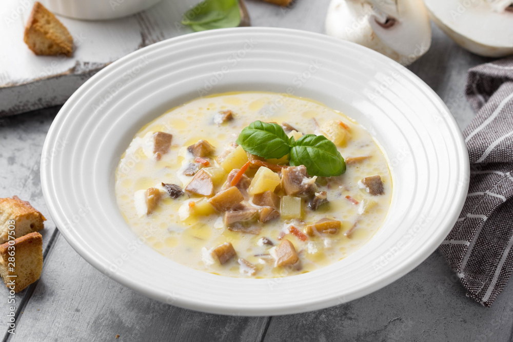 Cheese soup with mushrooms, potatoes, carrots and croutons Delicious cozy first course, autumn food Cheese soup with mushrooms, potatoes, carrots and croutons Delicious cozy first course, autumn food