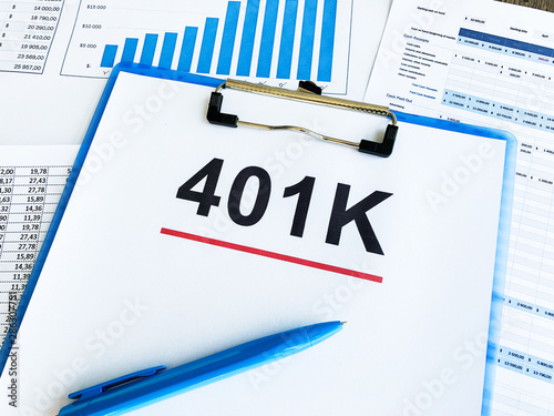 Paper with 401k plan on wood table