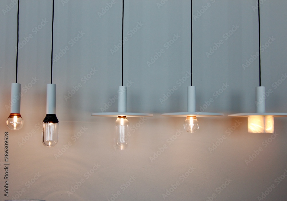 very clean, minimalistic hanging lamps in a row very clean, minimalistic hanging lamps in a row