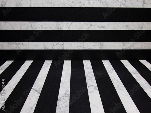 marble rectangular tiles in black and white on the wall and on the ground