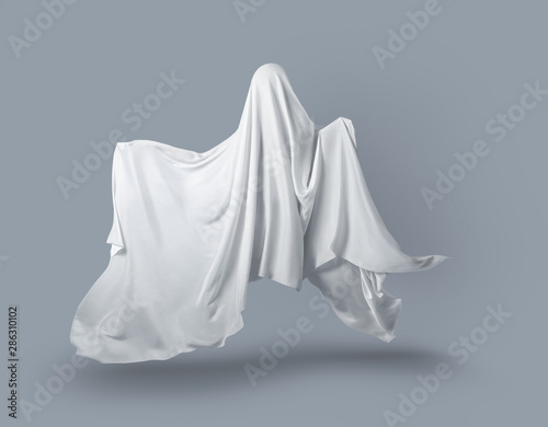 a Ghost in a white fabric fluttering in the wind on a gray background in the Studio. Halloween minimal concept.