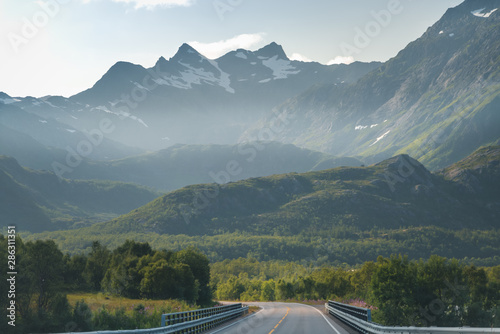 Highway in the mountains on the Loften Islands in Norway, beautiful landscape, sunset light photo