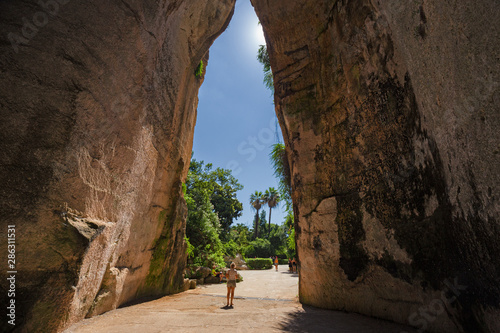 Exit of the excavated cave, called Orecchio di Dioniso, near the Greek theater of Syracuse, in Sicily Italy. photo