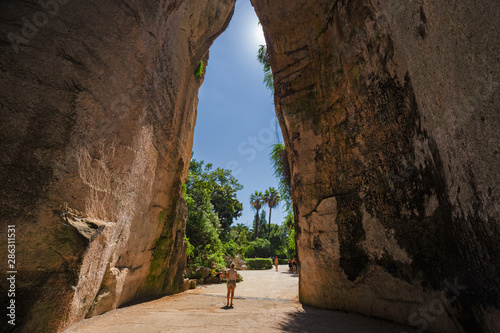 Obraz na płótnie Exit of the excavated cave, called Orecchio di Dioniso, near the Greek theater of Syracuse, in Sicily Italy. w salonie