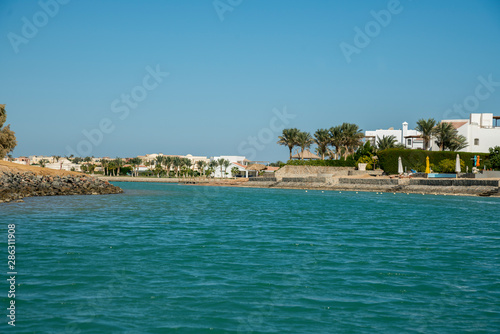Fototapeta Naklejka Na Ścianę i Meble -  Venice Sands, Egypt. November 20 2018 Luxury villa by the sea with palm trees and a beach
