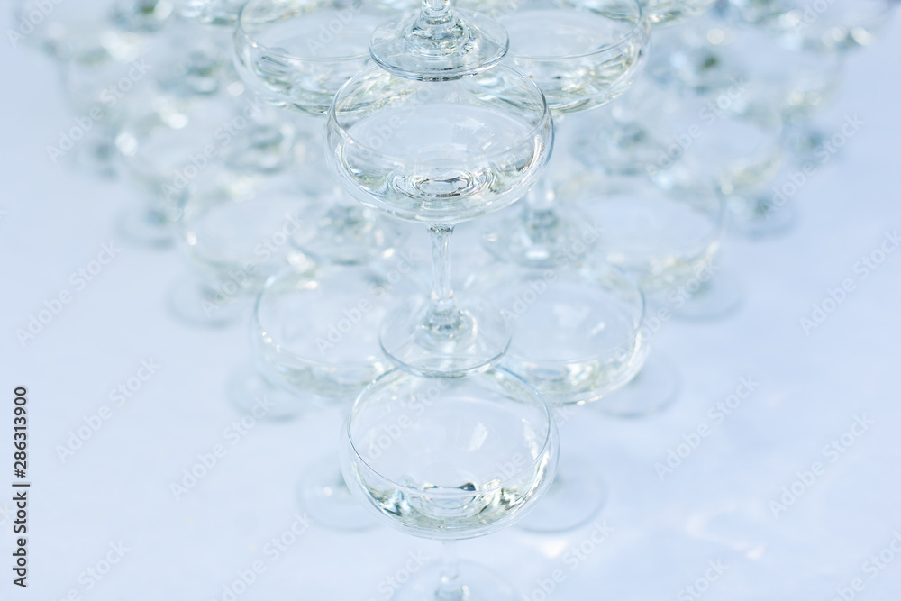 beautiful holiday table  glasses with martini wiht space for text. a set of glasses with alcohol. glasses of wine on a banquet table.