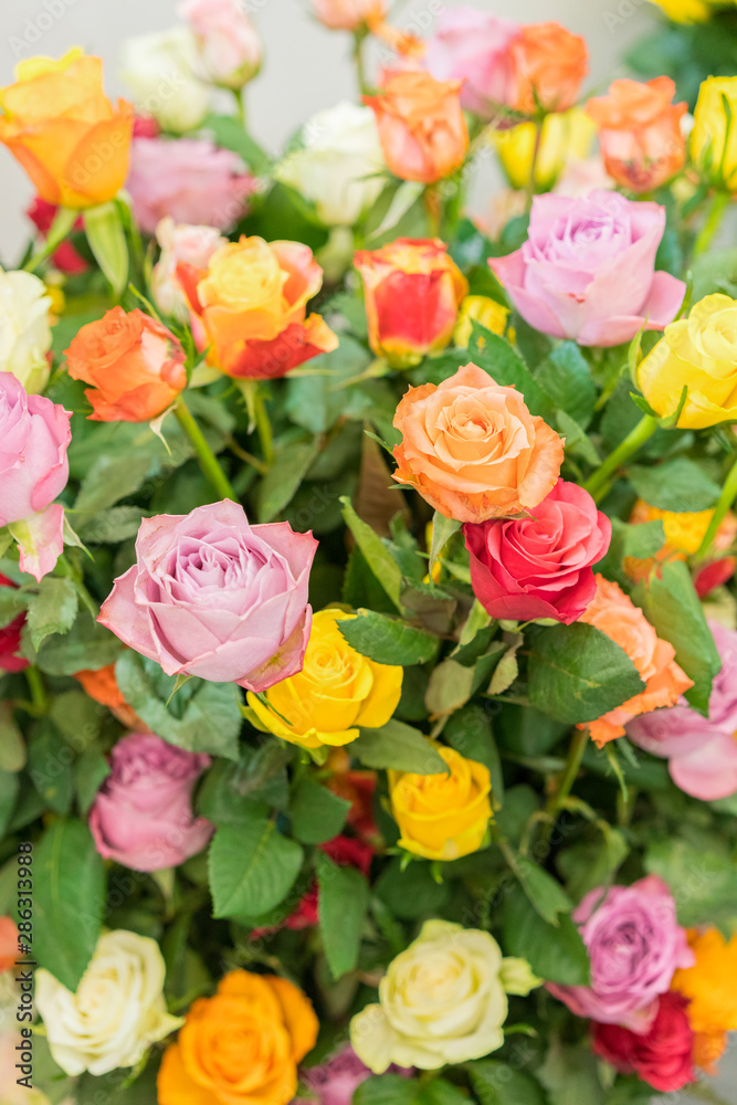 Bright multicolored bouquet of roses. Natural flowers background, soft  focus. Colorful roses flower background, group of multicolor rose make from  clay, handmade product. vertical photo Stock Photo | Adobe Stock