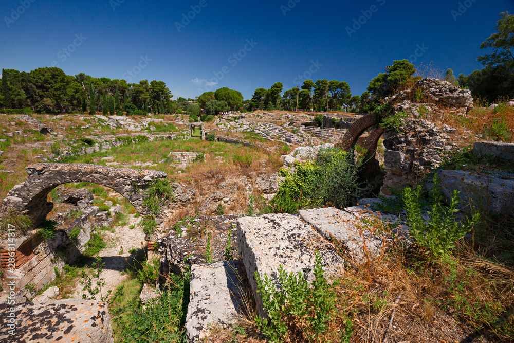 Panoramic view of the Roman amphitheater of Syracuse, in Sicily Italy. Panoramic view of the Roman amphitheater of Syracuse, in Sicily Italy.