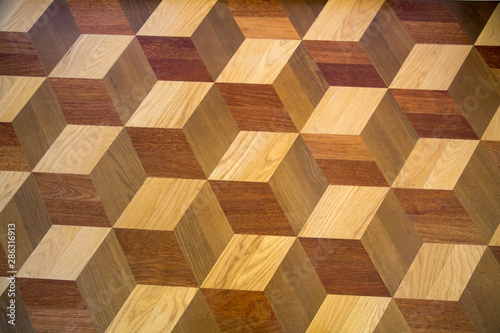 Background of parquet various wood species image volume squares. Backgrounds Structure Design.