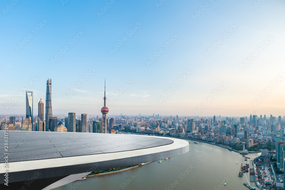 Empty floor and city skyline with buildings at sunset in Shanghai,China.