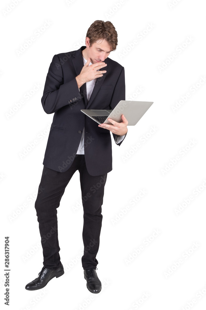 Full length portrait of handsome young businessman standing holding laptop computer and checking email or confused more data, isolated on white background. Full length portrait of handsome young businessman standing holding laptop computer and checking email or confused more data, isolated on white background.