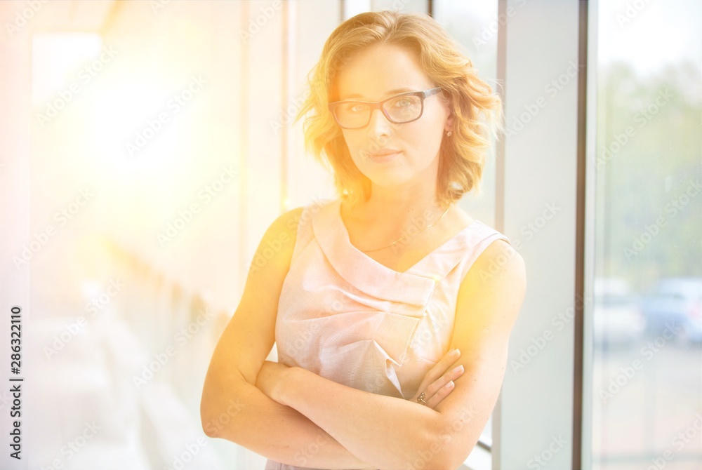 Portrait of confident businesswoman standing with arms crossed at new office Portrait of confident businesswoman standing with arms crossed at new office
