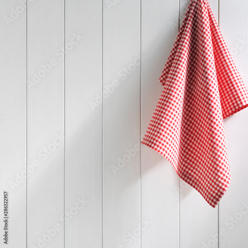 napkin hanging on white wall photo
