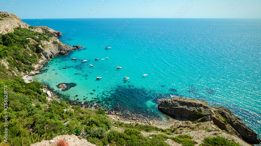 Yachts in the bay of the blue tropical sea