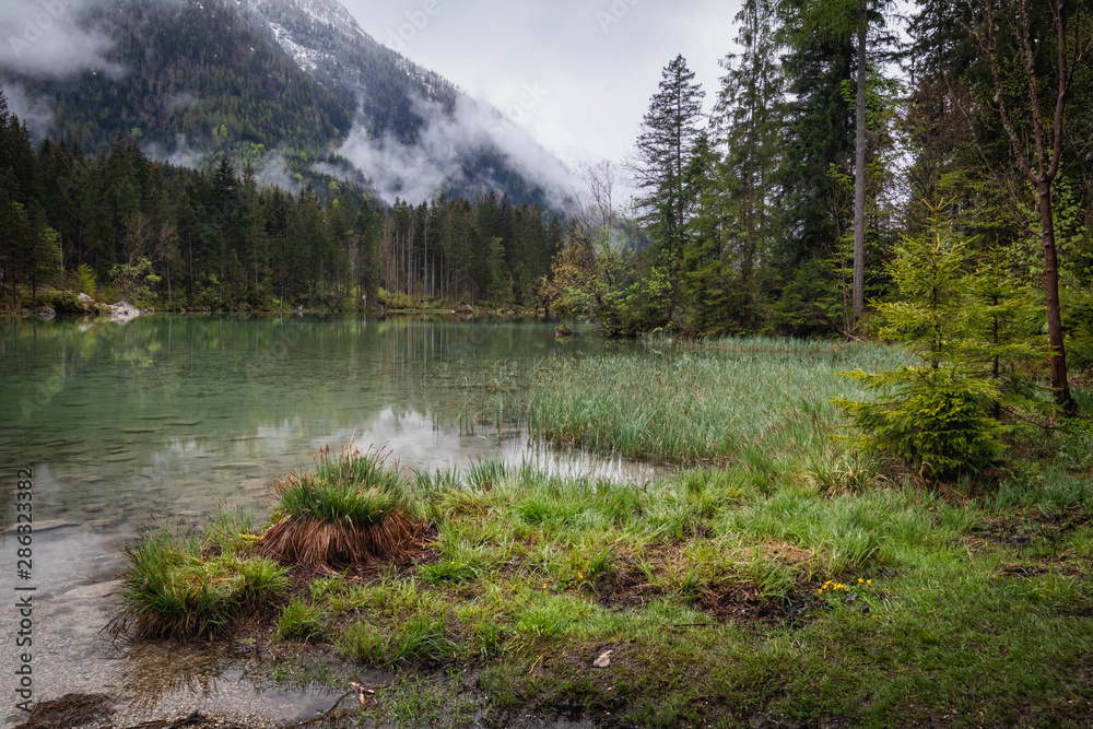 Misty summer morning on the Hintersee lake in German Alps