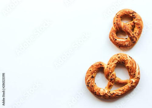  fresh golden pretzels on a white isolated background