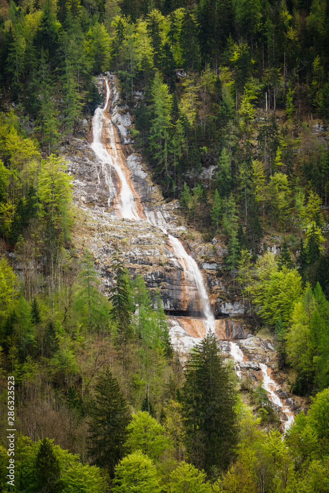 Beautiful vertical waterfall in Konigsee lake, Berchtesgaden national Park, Bavaria, Germany