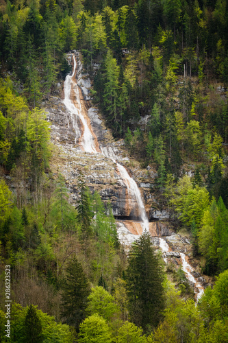 Obraz na płótnie Beautiful vertical waterfall in Konigsee lake, Berchtesgaden national Park, Bavaria, Germany w salonie