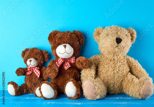  teddy bears on a blue background, friendship concept