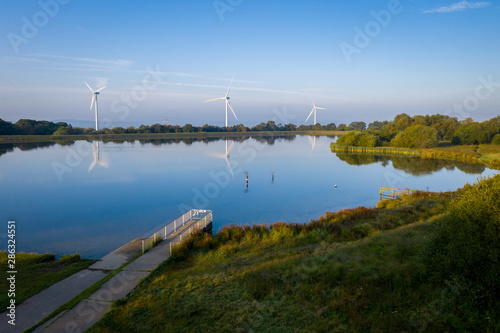 Pen-y-fan pond in Blackwood  Wales UK which has 3 wind turbines nearby