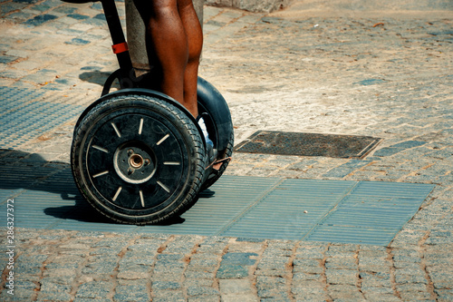 Black person riding on an alternative transportation photo